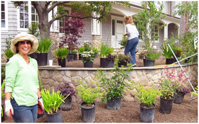 Carol and Janice landscaping a garden